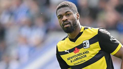 Emile Acquah in action for Barrow