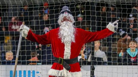 Santa in goal wearing a Chorley FC hat