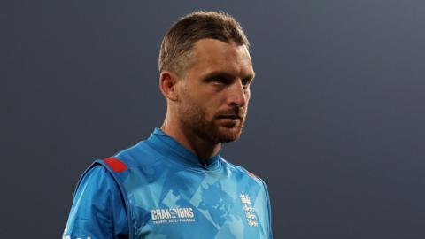 England captain Jos Buttler looks dejected walking off the field