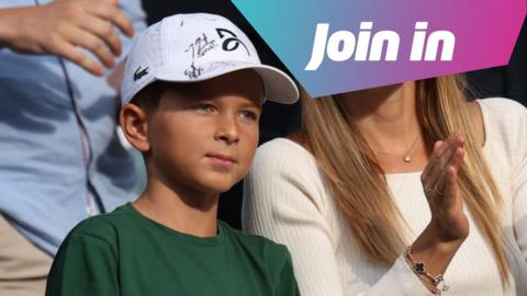 Stefan Djokovic standing next to his mum Jelena.