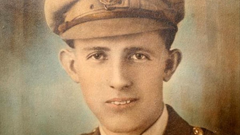 A colourised sepia picture of a man wearing World War One uniform.