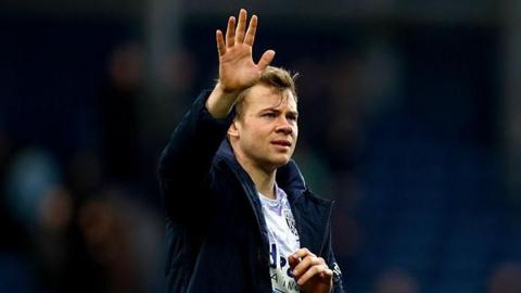 West Brom striker Aune Heggebo waves to the crowd after beating Hull City