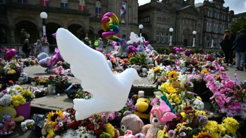 Flowers and dove balloon in Southport