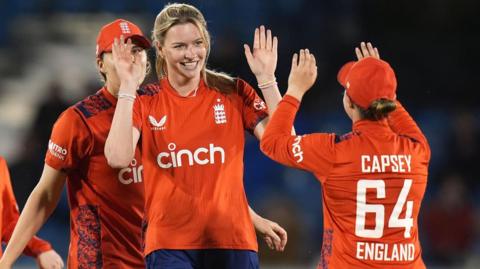 Lauren Bell celebrates a wicket with Alice Capsey