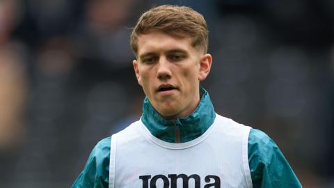 Ethan Galbraith warms up before a Swansea game