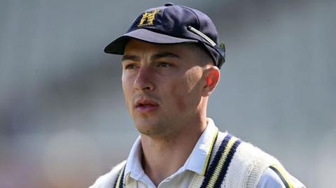 Michael Booth in his Warwickshire club cap