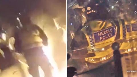 Flames erupt after petrol bomb explodes on impact in front of riot police