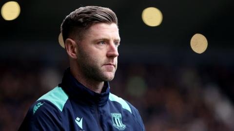 Stoke City caretaker boss Paul Gallagher watches from the touchline