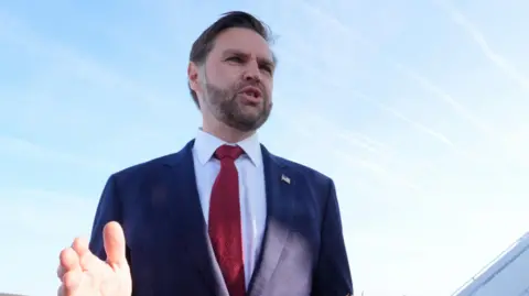 JD Vance speaks to the media before boarding Air Force Two for expected departure to Pakistan for talks on Iran