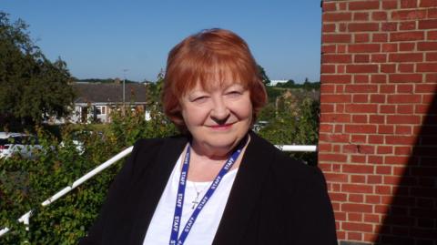 A woman standing outside in Harlow