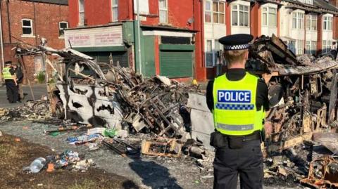 Burnt-out bus in Harehills