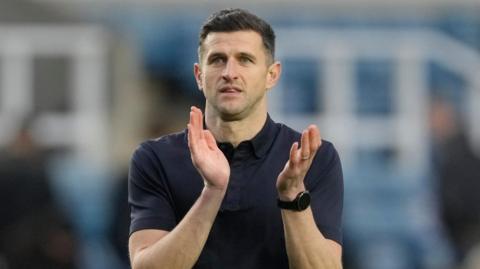 John Mousinho applauding Portsmouth fans