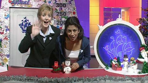 Konnie Huq and Yvette Fielding making a snowman out of cardboard and wadding.