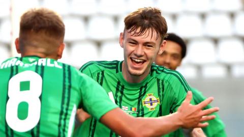 Conor Bradley celebrates one of his two goals in the 2-0 friendly win over Andorra