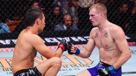 Ian Machado Garry and Shavkat Rakhmonov exchange words after their bout at UFC 310 in Las Vegas