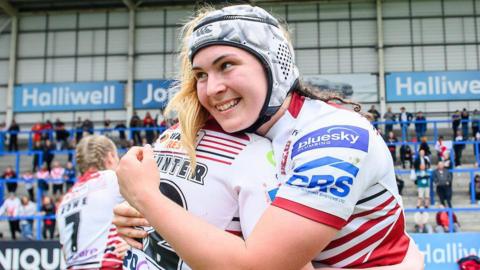 Megan Williams celebrates another win for Wigan Warriors and she scored two tries in their 56-12 win over Huddersfield Giants.