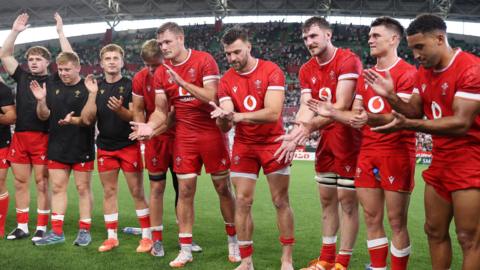 Wales players acknowledge the applause of the spectators in Kobe