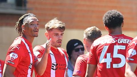 Orient players celebrate