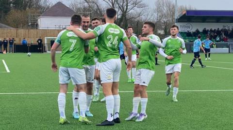 Guernsey FC players celebrate scoring