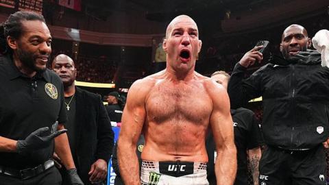Sean Strickland celebrates beating Khamzat Chimaev