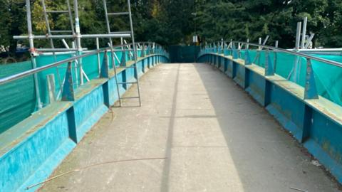 The pedestrian bridge is shown without all of its locks on 25 September.