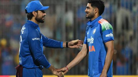 Afghanistan's Rahmat Shah shakes hands with India's Shubman Gill