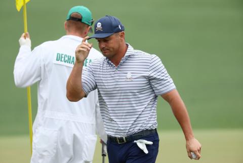 Bryson DeChambeau tips his cap to the patrons during the first round of the 2024 Masters