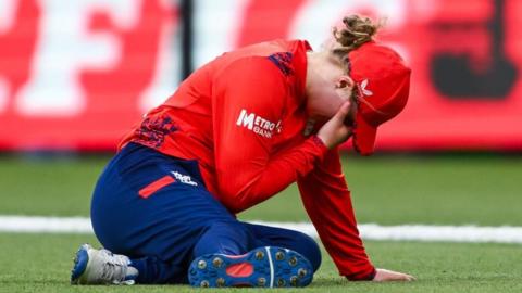 England's Charlie Dean reacts to dropping a catch v Australia