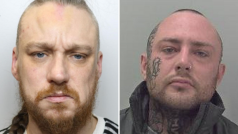 Leslie Lamb (left) has short tied back brown hair and a brown beard. Steve Mason has short dark hair, dark stubble and has a tattoed neck and right hand side of his face. 