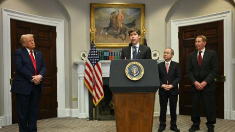 US President Trump (L), Masayoshi Son (2R), Chairman and CEO of SoftBank Group Corp, Larry Ellison (R), Executive Charmain Oracle listen to Sam Altman, CEO of Open AI speak in the Roosevelt Room of the White House on 21 January 2025