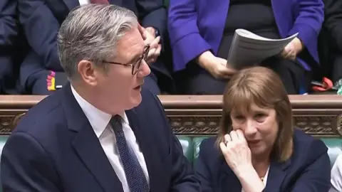 Reeves crying sitting next to Starmer in chamber