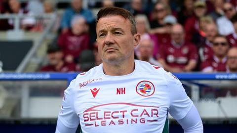 Reading boss Noel Hunt looks on before a game 