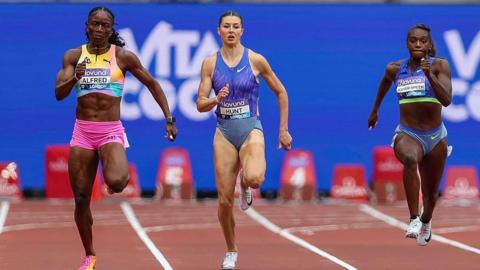 Julien Alfred of St Lucia and Amy Hunt of Great Britain run ahead of Dina Asher-Smith of Great Britain during the Women's 200m event at the Wanda Diamond League meeting at the London Stadium.