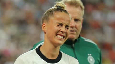 Germany's Giulia Gwinn reacts after sustaining an injury