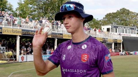 Charlie Bennett acknowledges his five-wicket haul against Surrey