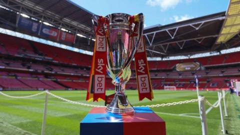 The Championship play-off trophy on display at Wembley