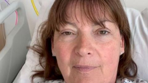 Lorraine Kelly seen in her hospital bed in a video posted on social media on Saturday