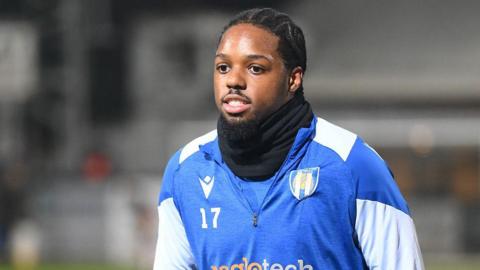 Colchester United's Jaden Williams taking part in the pre-match warm-up