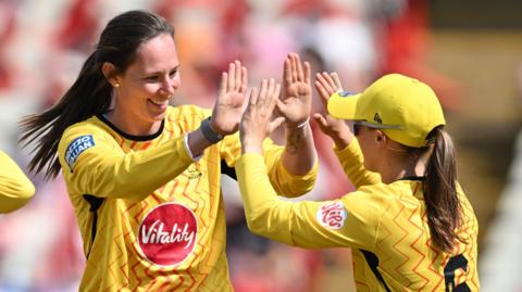 Samantha Bates of Trent Rockets Women celebrates with teammate Sophie Luff after taking the wicket of Alice Capsey of Birmingham Phoenix Women (not pictured)