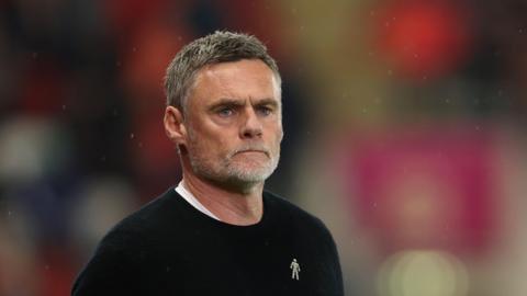 Graham Alexander watching his Bradford side in the match at Rotherham 