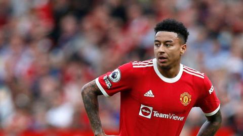 Jesse Lingard when he played for Manchester United, wearing the team's kit with his hands on his hips as they played Norwich City at Old Trafford on 16 April 2022.