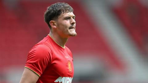 Will Lankshear playing in a pre-season friendly wearing his red Middlesbrough kit