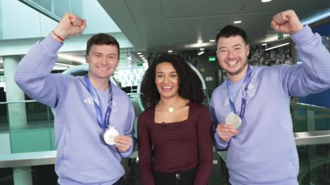 Bruce and Hammy with Nina, holding up their medals