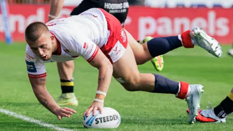 Hull KR's Mikey Lewis touches down to score a try against York Knights