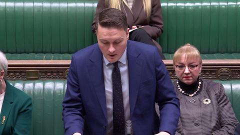 Health Secretary Wes Streeting in blue suit speaking in House of Commons