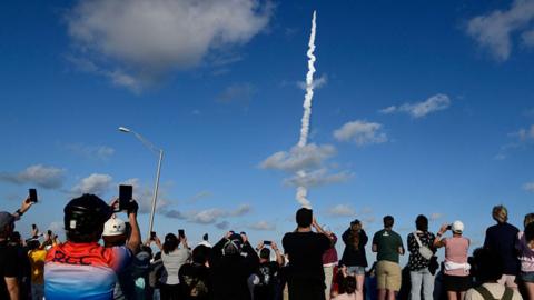 People watching lift off