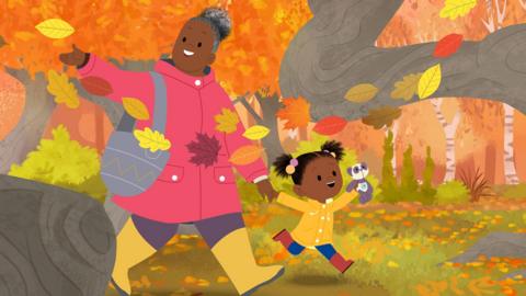 JoJo and Gran Gran on a walk in the woodlands with swirling autumn colours and leaves