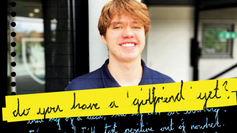 A teenage boy smiles into the camera, wearing a navy blue polo neck t-shirt. The image has graphics of a hand-written letter laid over the top, with the text 'Do you have a girlfriend yet?' highlighted in bright yellow.