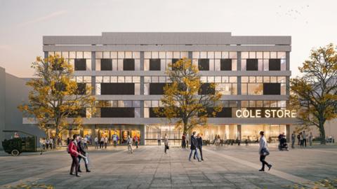 The outside of the building with people walking in the foreground. The building has an illuminated sign which says Cole Store