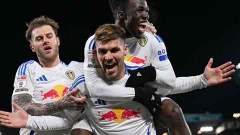 Leeds players celebrate a goal against Luton